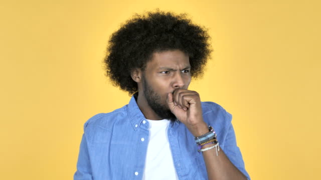 Sick-Afro-American-Man-Coughing-on-Yellow-Background