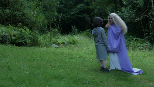 4k-Fantasy-Shot-of-a-Fairy-Talking-with-a-Child-in-the-forest