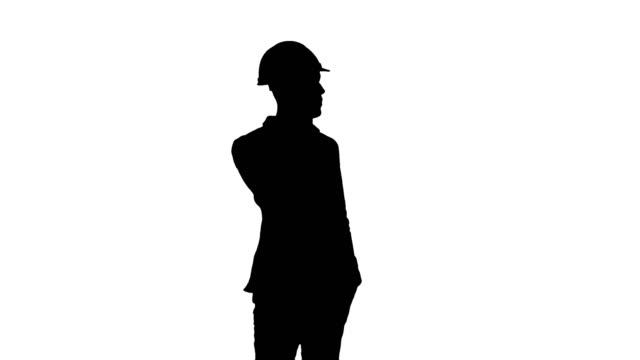 Silhouette-Contractor-in-hardhat-talking-on-his-cell-phone