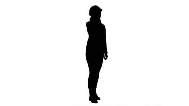 Silhouette-Beautiful-female-engineer-in-hardhat-havin-a-phone-call-correcting-the-project