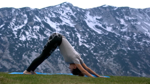 woman-practicing-yoga-outdoors