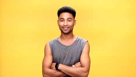 Young-happy-african-man-over-yellow-background.