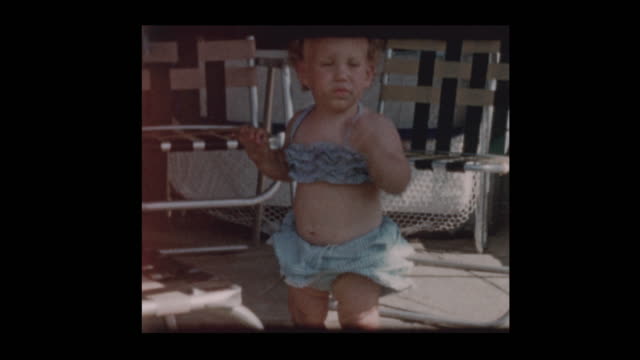 Cute-little-girl-in-2-piece-bathing-suit-1961