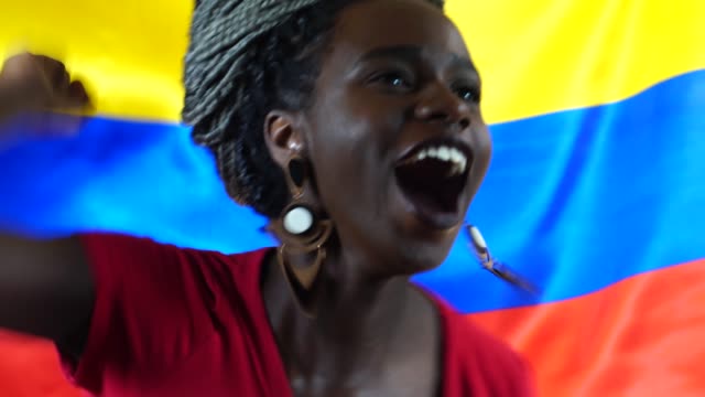 Colombian-Young-Black-Woman-Celebrating-with-Colombia-Flag