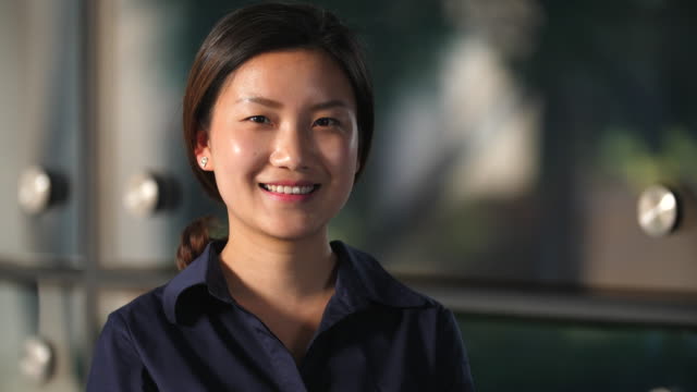 Portrait-of-Happy-Young-Chinese-woman-smile-at-camera-in-Slow-Motion,-4k