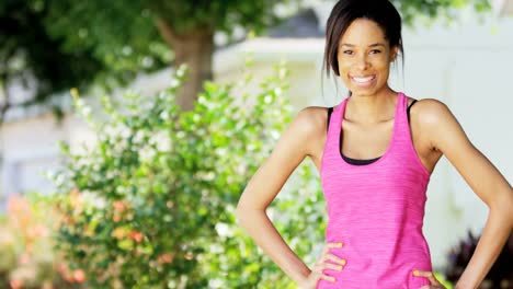 Portrait-smiling-African-American-girl-wearing-workout-clothing
