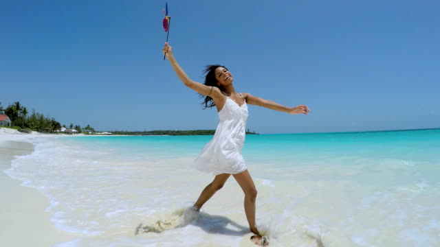 Selfie-of-ethnic-girl-dress-on-Caribbean-beach