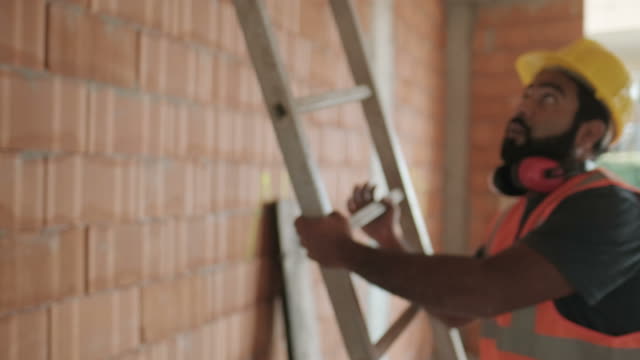 Portrait-Of-Happy-Hispanic-Worker-Smiling-In-Construction-Site