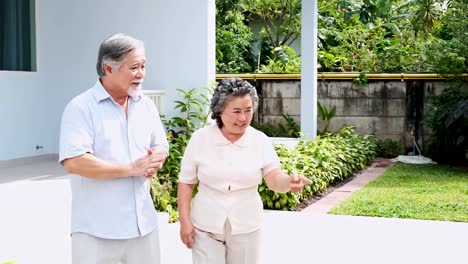 Senior-couple-walking-around-nursing-home.