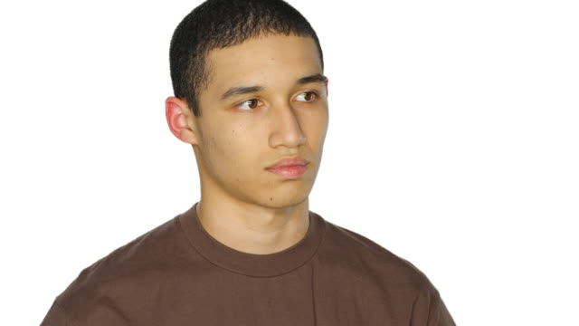 Young-man-looks-around-sadly,-on-a-white-studio-background