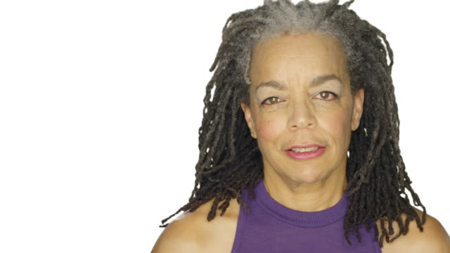 Mature-woman-stares,-on-a-white-studio-background