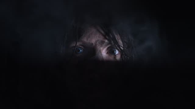 4k-Horror-Shot-of-a-Dirty-Zombie-Woman-Looking-Through-a-Hole