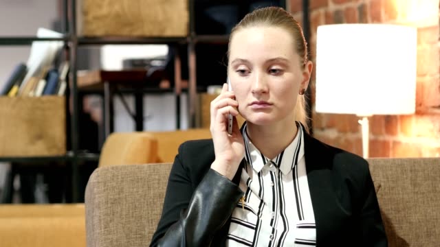 Business-Woman-Talking-On-Smartphone