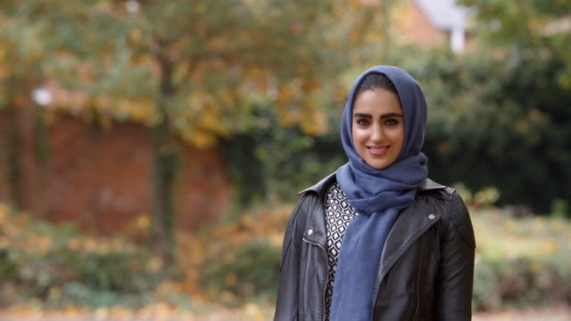 Portrait-Of-British-Muslim-Woman-In-Urban-Park