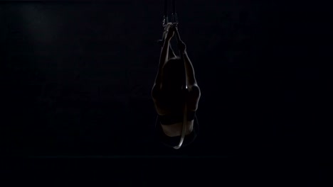 Beautiful-gymnast-make-an-element-"man-in-the-moon"-on-aerial-hoop