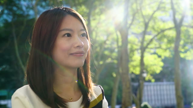 Attractive-Chinese-Woman-in-Urban-Environment.-Looking-at-the-Camera-with-Dark-Eyes-and-Dyed-Hair.