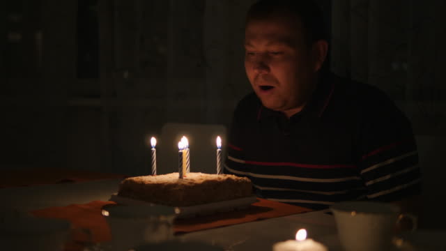 Birthday,-birthday-boy-extinguishes-candles