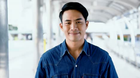 Portrait-Asian-handsome-man-looking-at-the-camera-and-smiling