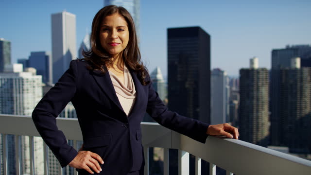 Portrait-of-Latin-American-businesswoman-on-city-rooftop