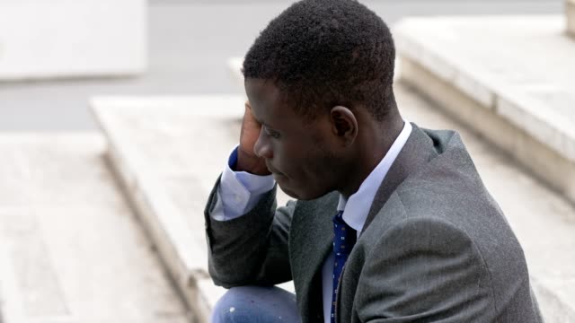 Pensive-sad-lonely-American-african-business-man.-job-problems