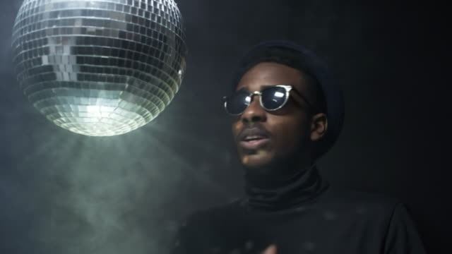 Man-Rapping-and-Spinning-Disco-Ball