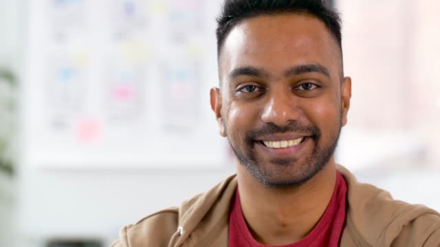 portrait-of-happy-smiling-indian-man-at-office