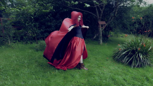 4k-Halloween-Shot-of-Red-Riding-Hood-Standing-in-the-Wind