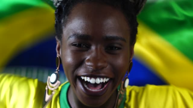 Brazilian-Young-Black-Woman-Celebrating-with-Brazil-Flag