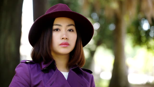 pensive-serious-Asian-Woman-Portrait-,-outdoor