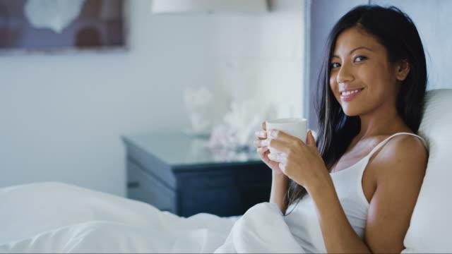 Woman-Waking-up-Drinking-Coffee