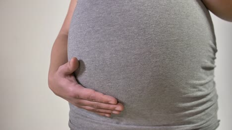 Close-Up-on-9-Month-Pregnant-Belly-Mother