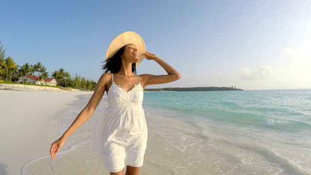 African-American-female-enjoying-freedom-on-tropical-beach