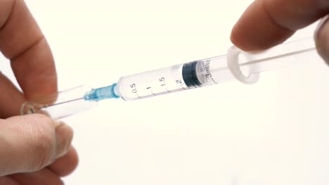 syringe-in-which-a-drug-is-taken-from-ampoule