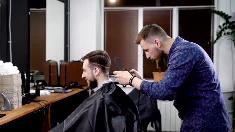 A-visitor-of-a-barbershop-wants-to-get-a-fashionable-hairdo-in-barbershop,-an-adult-man-expects-the-hair-line-to-be-trimmed