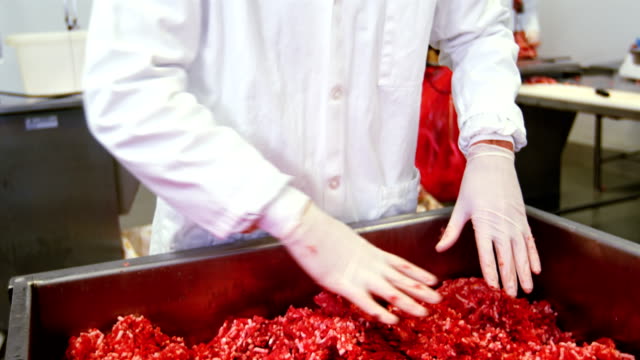 Butcher-preparing-minced-meat