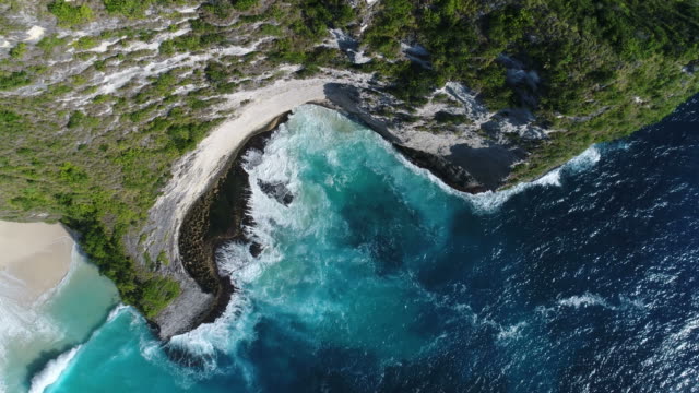 Aerial-drone-footage-of-ocean-waves-washing-up-on-rock