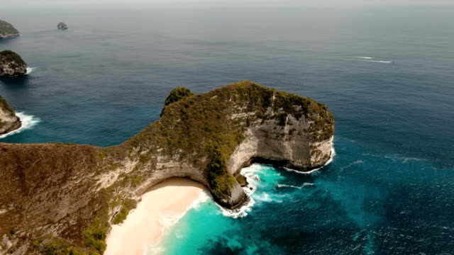 Rocky-cliff-with-beach-in-the-sea.-Karang-Dawa