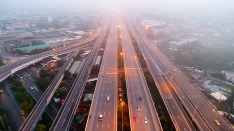 Aerial-view-traffic-on-highway-with-mist-in-morning.
