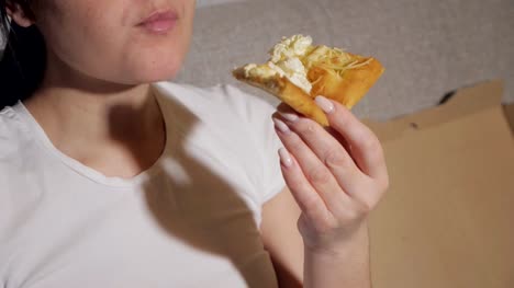 woman-enjoy-eating-pizza-at-home