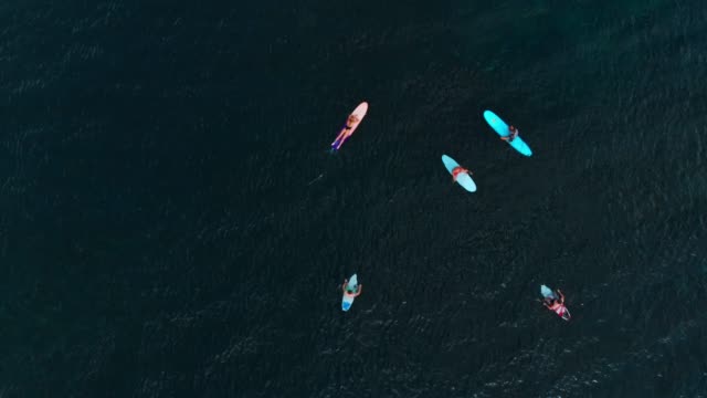 Ocean-and-surfers-on-surfboard-waiting-waves.-Aerial-view,-top-view