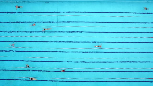 Swimmers-practice-in-swimming-pool-winter.-Aerial-shot