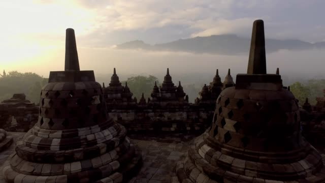 Borobudur-temple-at-sunrise,-Central-Java,-Indonesia.-4K-resolution-video-Travel-religion-exploration-concept