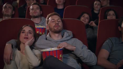 Love-couple-watching-movie-in-cinema-theatre.-Movie-entertainment