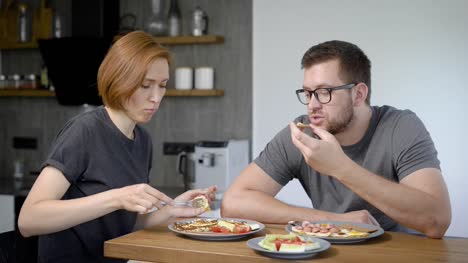 Relaxed-couple-having-delicious-breakfast