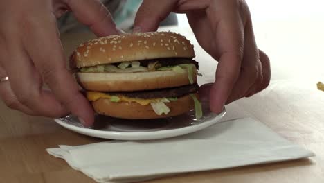 Close-up-of-a-girl-enjoying-a-fresh-hamburger