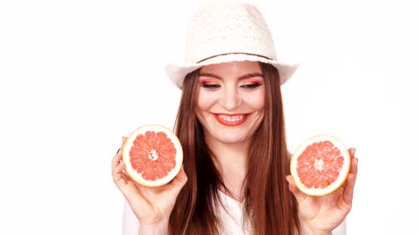 Woman-joyful-girl-holds-grapefruit-citrus-fruit-in-hands-4K