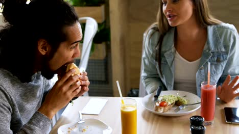 Couple-having-food-in-restaurant-4k