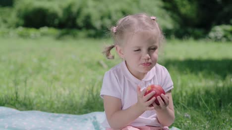Healthy-Nutrition.-Child-Eating-Juicy-Apple-Outdoors