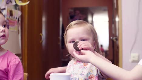 Little-baby-girl-eating-cookies