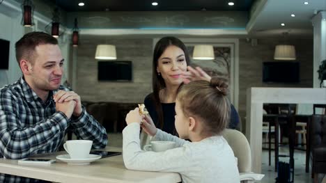 Family-In-Cafe.-Father-and-daughter-meeting-mother